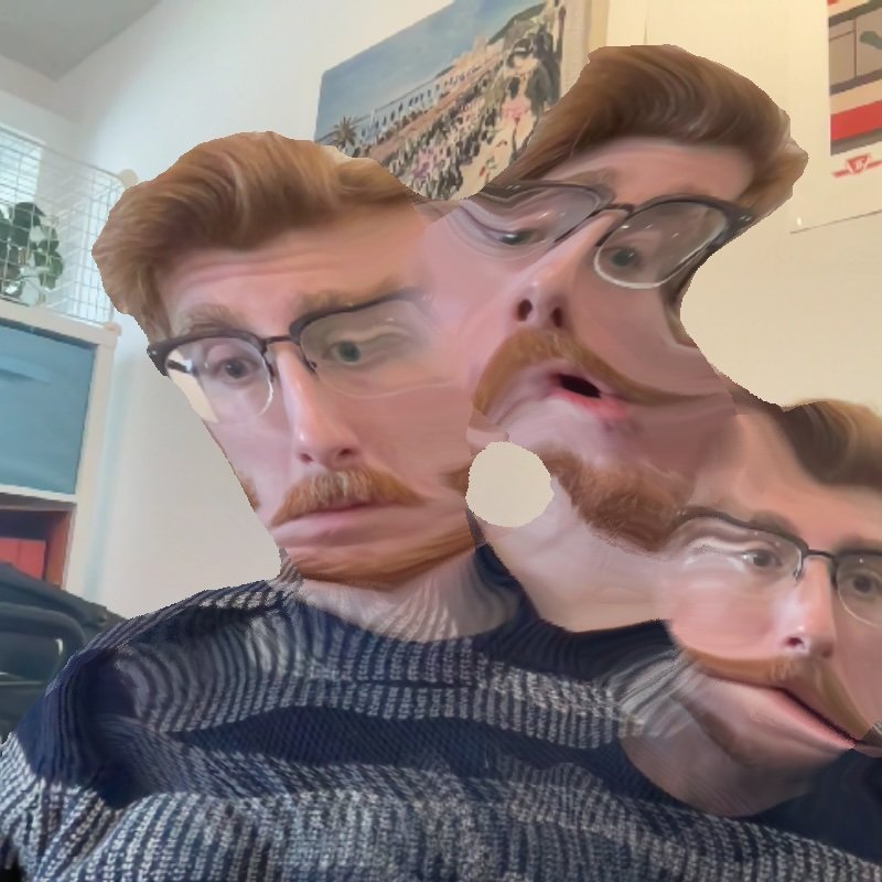 Webcam image of a bearded bespectacled man, with three smeared copies of his head thanks to shader shenanigans