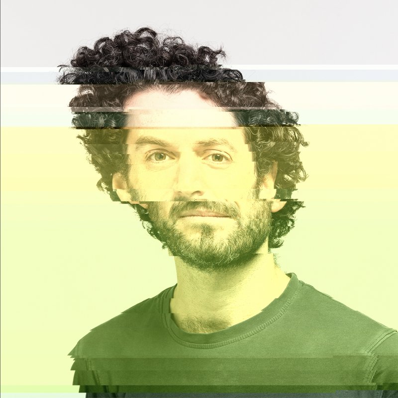 Portrait of Ted, manipulated with p5.glitch, offsetting color and position of pixels from top to bottom.